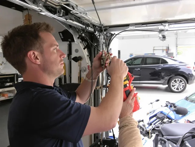 St. Cloud Garage Door Repair safety certified technician performing cable replacement in St. Cloud