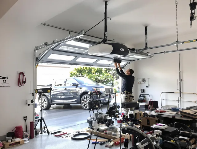 St. Cloud Garage Door Repair specialist installing smart garage door opener system in St. Cloud home