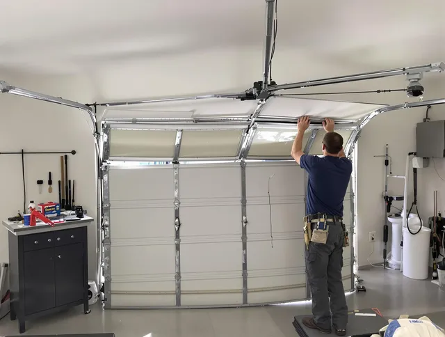 St. Cloud Garage Door Repair specialist performing precise section replacement on St. Cloud garage door